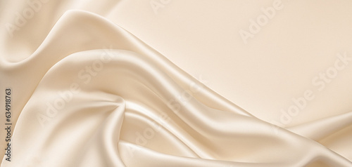 Soft pastel beige cream color, shiny satin silk swirl wave background banner - Abstract textile fabric material, backdrop texture for product display or text