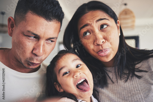 Selfie, silly and portrait of girl with her parents bonding in the living room of their home. Goofy, happy and child taking a picture with her mother and father with funny faces at their family house