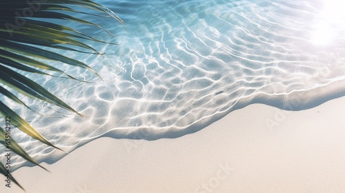 Beautiful abstract background concept banner for summer vacation at the beach with palm leaf shadow on abstract white sand beach background, sun lights on sea surface.
