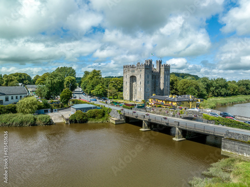 Aerial view of Bunratty Castle large 15th-century tower house in County Clare in Ireland guarding the crossing on the Ralty river before it reaches the Shannon estuary