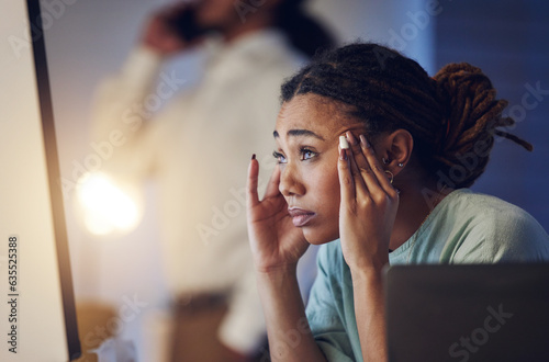 Business woman, anxiety and stress at computer in office at night working late on deadline. Tired African entrepreneur person with hand on head for pain, headache or burnout thinking of work crisis