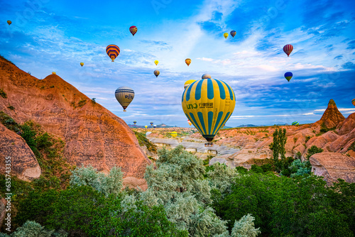 Cappadocia, Turkiye - July 07, 2023-Air balloons in Cappadocia-unreal views in valley.