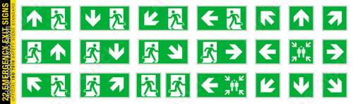 Full set of 22 isolated Emergency exit symbols on green rectangle board. Official ISO 7010 safety signs standard