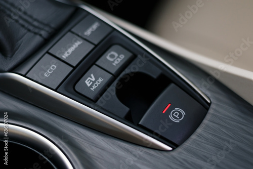 electronic parking brake or electronic handbrake in modern car, shallow depth of field