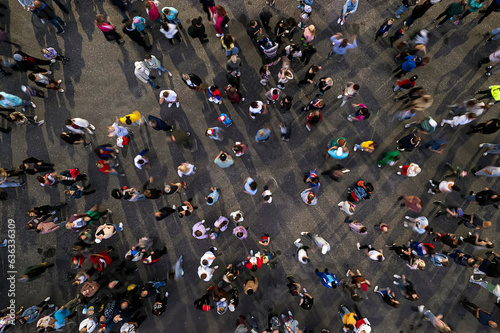 crowd people background. An aerial shot of the people gathered for an event. Crowed open-air meeting people shot from a height. A mass people gathered to celebrate an event. Open-air night festival.