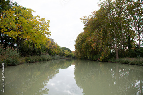 River with leafy trees. Canal du Midi is a navigable waterway in France linking the Garonne River at Toulouse with the Mediterranean Sea.