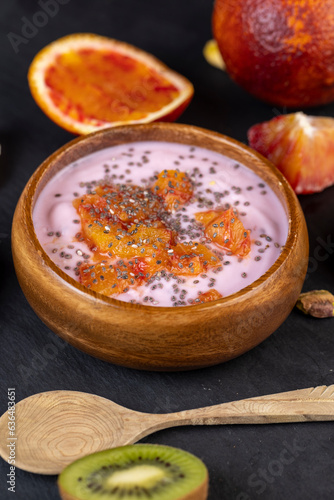 fresh yogurt with berries and fruits with red oranges