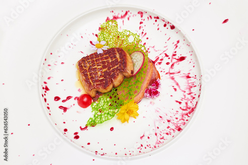 Top view of Foie gras and smoked duck breast with mixed berry sauce in white dish isolated on white background.
