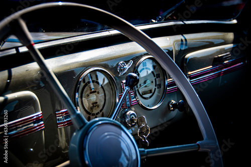 Oldtimer car dashboard, steering wheel and ignition key