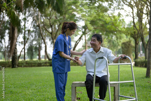 Asian Female Doctor Help Support the Elderly and Provide Encouragement During Treatment. Rehabilitation or Physical Therapy of Asian Retired Patients with Walking Aids.