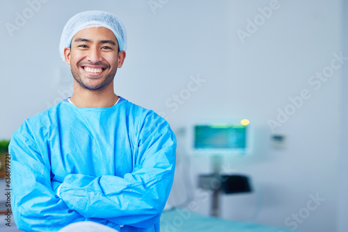 Portrait, surgeon and Asian man with arms crossed in hospital, healthcare and wellness. Face, happy doctor and medical professional, expert nurse and confident surgery employee in scrubs in Cambodia