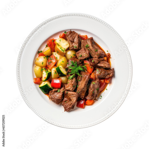East European cuisine goulash with roast beef vegetables on a white plate set on a transparent background