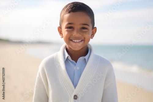 Medium shot portrait of an Indian child male in a beach 