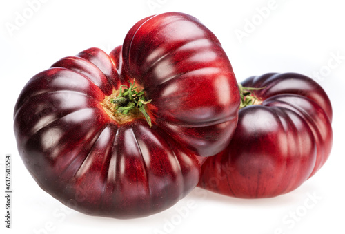 Ripe black or purple tomatoes isolated on white background.