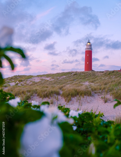 Texell lighthouse during sunset Netherlands Dutch Island Texel in summer with sand dunes at the Wadden Island during dusk