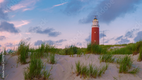 Texell lighthouse during sunset Netherlands Dutch Island Texel in summer with sand dunes at the Wadden Island