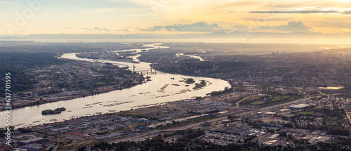 Aerial View of Fraser River and City. Cloudy Sunset Sky. Panorama. Pitt Meadows, Vancouver, BC, Canada