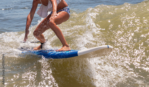 Young girl surfing close up