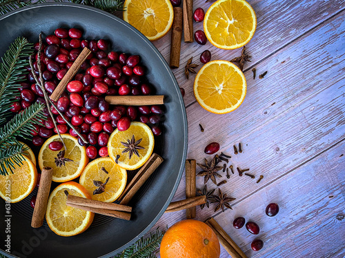 Flat lay of ingredients to make home smell like Christmas with a homemade simmering Christmas potpourri for a Holiday textured background.