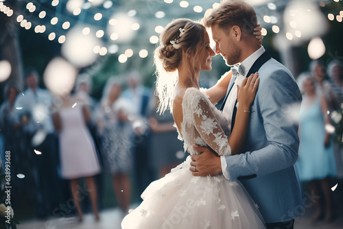 The bride and groom are dancing at the wedding 1