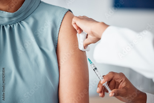 Hands, medical and doctor with patient for vaccine in a clinic for healthcare treatment for prevention. Closeup of a nurse doing a vaccination injection with a needle syringe in a medicare hospital.