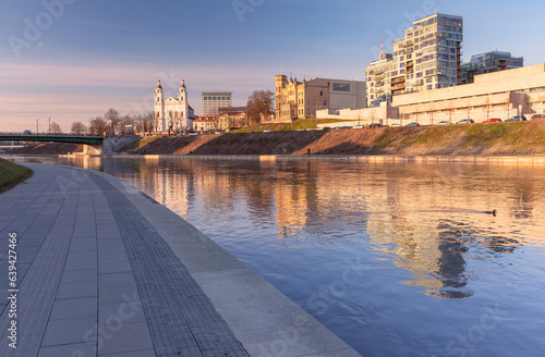 Sunset over Neris river, church and skyscrapers of New Center of Vilnius, Lithuania, Baltic states.