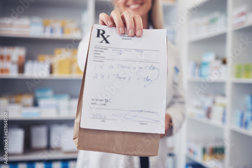 Woman, pharmacist and hand with paper bag for prescription, note or doctor certificate at pharmacy. Closeup of female person or medical professional giving medication or pharmaceutical at drugstore