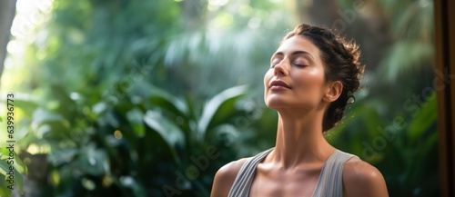Young beautiful woman practicing mindful breathing or deep relaxation techniques, emphasizing the importance of breath awareness