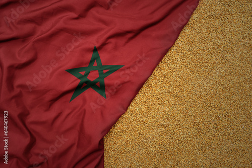 wheat grain on the waving colorful big national flag of morocco .