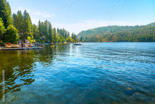 Summer day view of lakefront homes and docks at lower Twin Lakes, an 850 acre lake in the small suburban town of Twin Lake, Idaho, a suburb of the general Coeur d'Alene area of North Idaho.