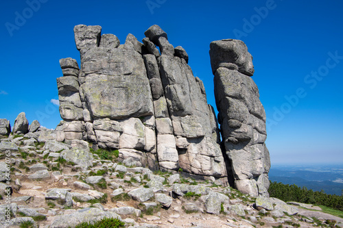 Granite rock in poland part of Giant mountains Krkonose called Słonecznik, sunny summer touristic season with blue sky