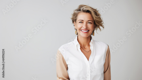 Beautiful mature woman on an solid colored background