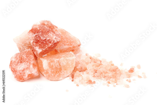 Chipped Himalayan salt stone, crystals and crushed blocks of natural pink salt isolated on white background