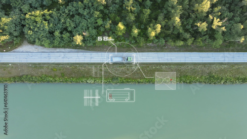 Aerial footage of a new hi tech futuristic way of control the speed of the truck and reveal detail about the truck. Artificial Intelligence Scans data with surveillance purpose