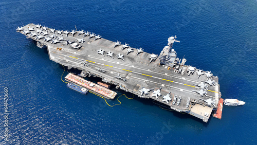 Aerial drone photo of latest technology American flag nuclear aircraft carrier USS Gerald Ford anchored in deep blue sea
