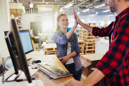 Young caucasian woman reciving positive feedback from colleague