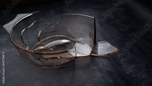 Broken pyrex dish on a table.