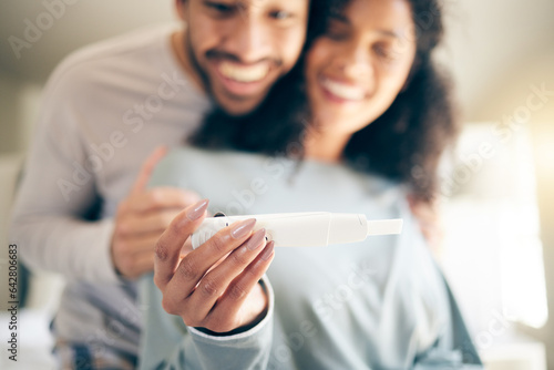 Pregnancy test, hands of woman and happy couple, smile and baby announcement together in home. Pregnant, person and new mother, fertility and support for positive results and ivf success or news