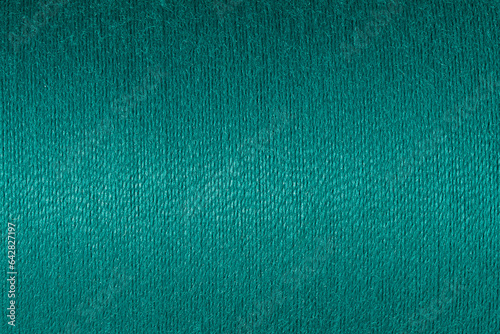 Abstract fabric texture background, close up picture of verdigris green color thread, macro image of textile surface, wallpaper template for banner, website, poster, backdrop.