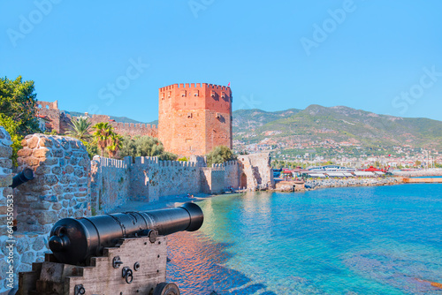 The famous red tower (Kizil Kule) with black cannon - The symbol of the resort town of Alanya - Alanya, Turkey