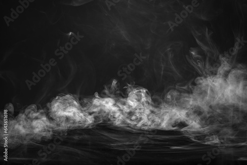 Abstract Halloween background. Fog or mist in darkness. Smoke on table