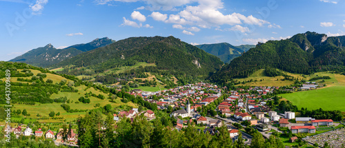 Terchova, mountain panorama of Mala Fatra National Park with a small village in the valley. View from the Terchovske srdce lookout tower, a tourist attraction on the hiking trail.