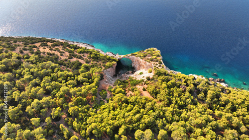 Aerial drone photo of secluded paradise emerald cave and beach called cave of the seals in Perachora, Corinthia, Greece