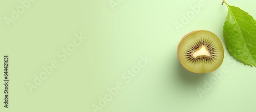 Small kiwi fruit actinidia arguta against isolated pastel background Copy space