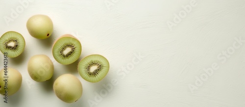 Small kiwi fruit actinidia arguta against isolated pastel background Copy space