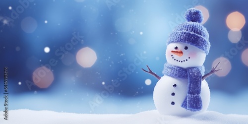 Christmas winter background with snowman in snow and blurred bokeh background.Merry Christmas and happy new year greeting card with copy space.