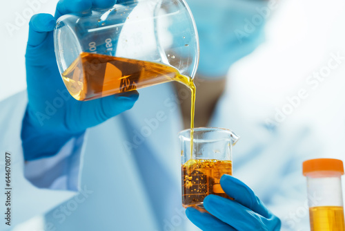 Close-up of laboratory technician conducting rigorous oil test, ensuring product integrity and safety, oil sample for quality control and purity testing, advancing petrochemical knowledge