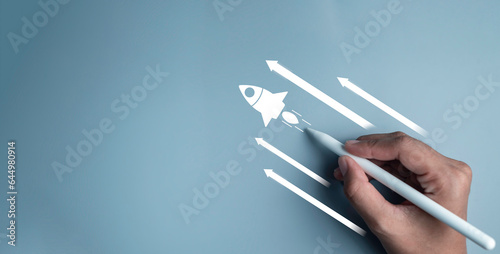 Business start up, start, new project, new idea concept. Magnifying glass focus on rocket launch with arrow Leadership business strategy for goal target success.