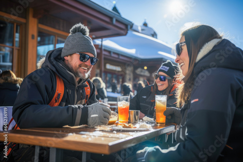 Winter camaraderie, friends gather on a snowy day, savor drinks outdoors after skiing.