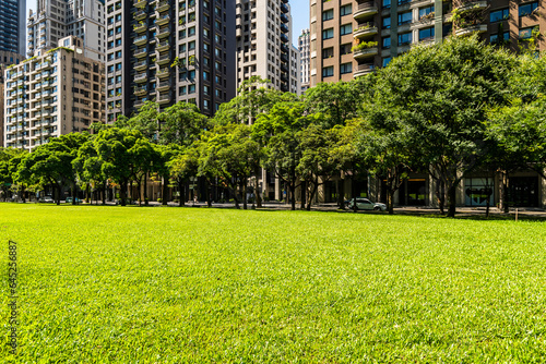Morning view of green park space and modern buildings in downtown Taichung, Taiwan, near the National Taichung Theater.